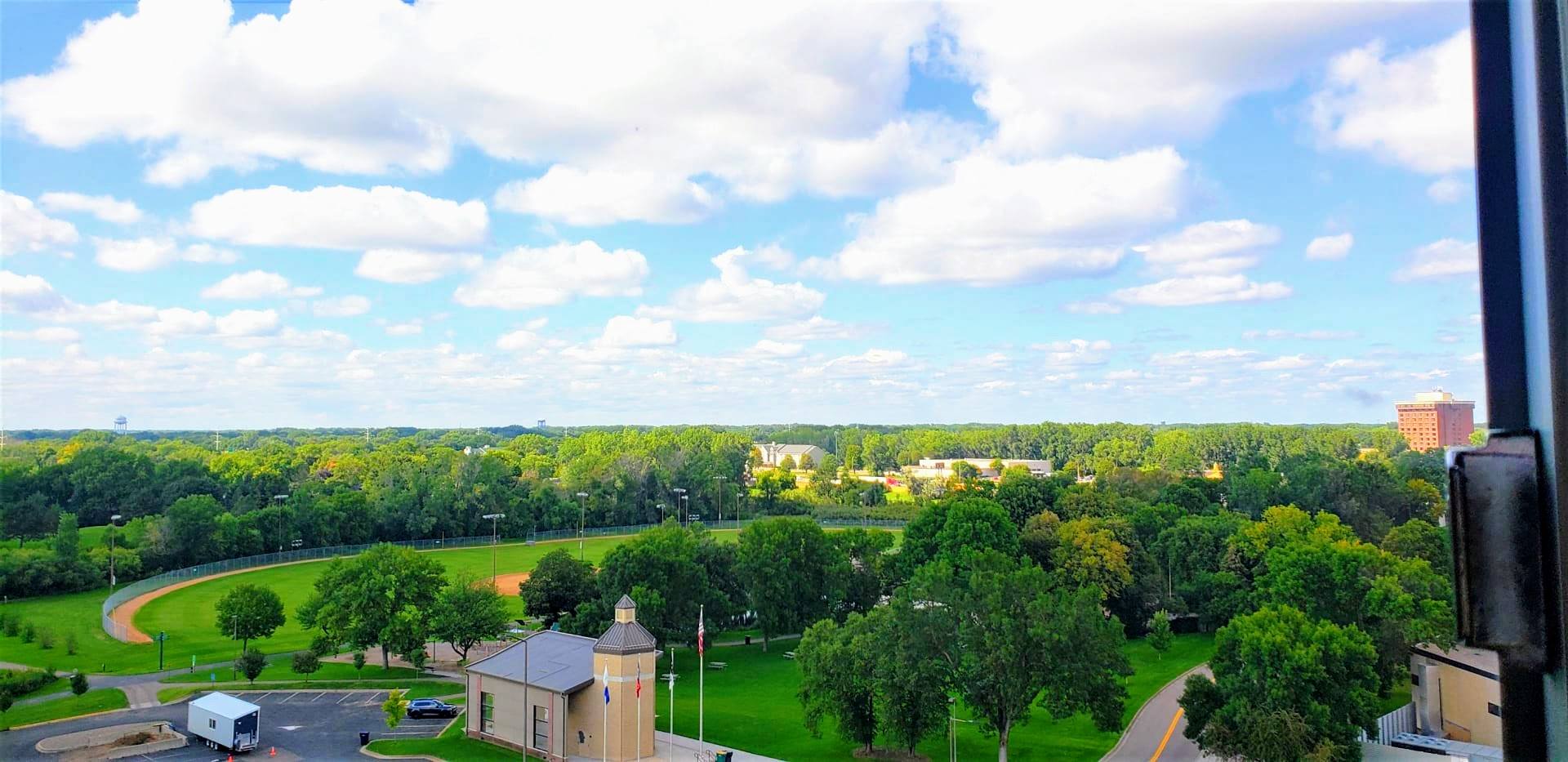 Situated near several parks, including Centennial Park, which is home to a playground, baseball field, and a large open field perfect for picnics and outdoor activities.
